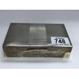 A hallmarked silver cigarette box, London 1961