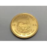 Another 1984 Krugerrand gold coin.