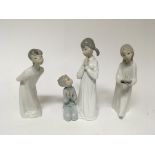 Three Lladro figures of children in night gowns. O
