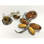 4 items of sterling silver and amber jewellery.