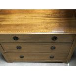 A small Edwardian inlaid mahogany chest of drawers