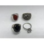 4 silver and stone set rings.