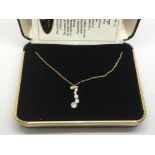 A boxed 'Journey of life' gold pendant set with CZ