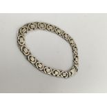 A 9 ct white gold bracelet 27 grams