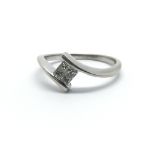 An 18ct white gold and princess cut diamond ring,