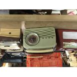 A collection of 13 vintage radios.