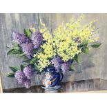 A framed pastel still life study with flowers in a