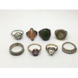 A collection of eight silver rings, various design
