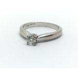 An 18ct white gold and diamond solitaire ring, app