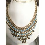 A Deco style gold tone and blue stone necklace on