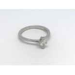 An 18ct white gold solitaire diamond ring set with