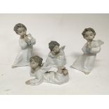 A group of four Lladro figures winged cherubs (4)