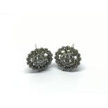 A pair of 18ct white gold diamond cluster earrings