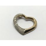 A 9ct gold heart shaped pendant set with diamonds,
