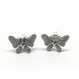 A pair of 9ct white gold diamond earrings in the f