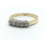 An 18ct yellow gold and five stone diamond ring, a