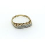 An 18ct gold five stone diamond ring, approx .15ct