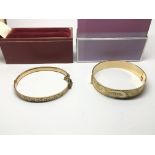 Two 9ct gold plated bangles.