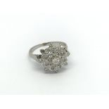 An 18carat white gold diamond cluster ring. ring s