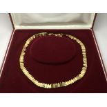 A cased 9ct gold necklace, approx 10.5g.