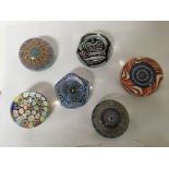 A collection of six millefiori paperweights includ