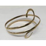 A 9carat gold scroll bangle weight 34g