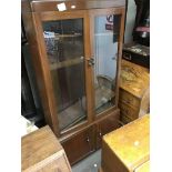 A mahogany glazed cabinet and an oak display cabin