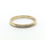 An 18ct yellow gold half eternity ring with a row