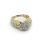 An 18ct gold and diamond cluster ring, approx 0.50