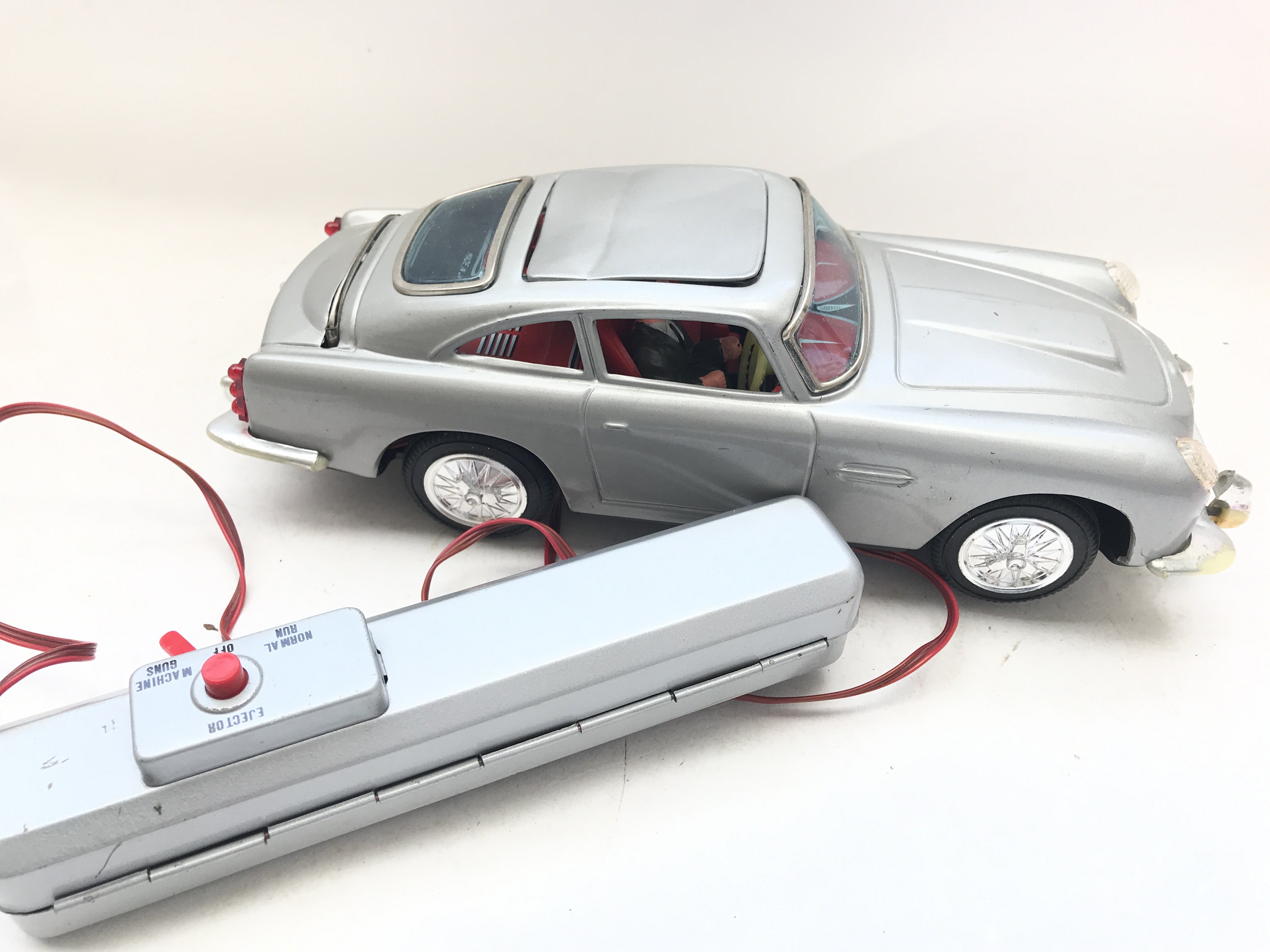 A Boxed Aston-Martin Secret Ejector R/C Car boxed.