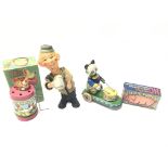 A Vintage Figure Push up Figure of a Drinker, Drumming Panda on Wheels, Clucking Hen in Box and a