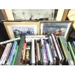 A collection of model railway books and framed rai