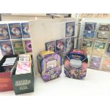 A collection of Pokemon cards.in tins, boxes and f