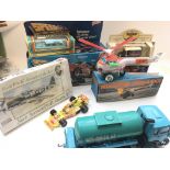 A collection of various toys including a tin plate