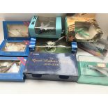 A collection of boxed Diecast aircraft including 3