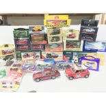 A box containing a large collection of boxed and loose Die cast vehicles. Including Corgi Classics.