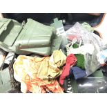 A Suitcase containing action man parts.cloths.guns