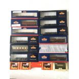 Twelve boxed Bachmann OO gauge rolling stock and railway carriages plus smaller boxed Hornby rolling