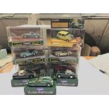 A collection of classic Corgi diecast cars.