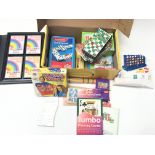 A box containing small games including connect 4,D