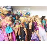 A box containing a collection of Barbie dolls, acc