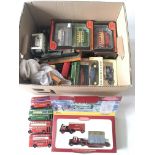 A box of various Yesteryear die cast model vehicles and other examples.