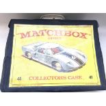 A Matchbox Series Collectors case and cars.