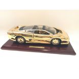 A 22ct Gold Plated Jaguar XJ220 with display box 1