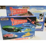 A Boxed Matchbox Thunderbirds Tracy Island and a boxed Thunderbirds Rescue Pack.and a captain Scarle