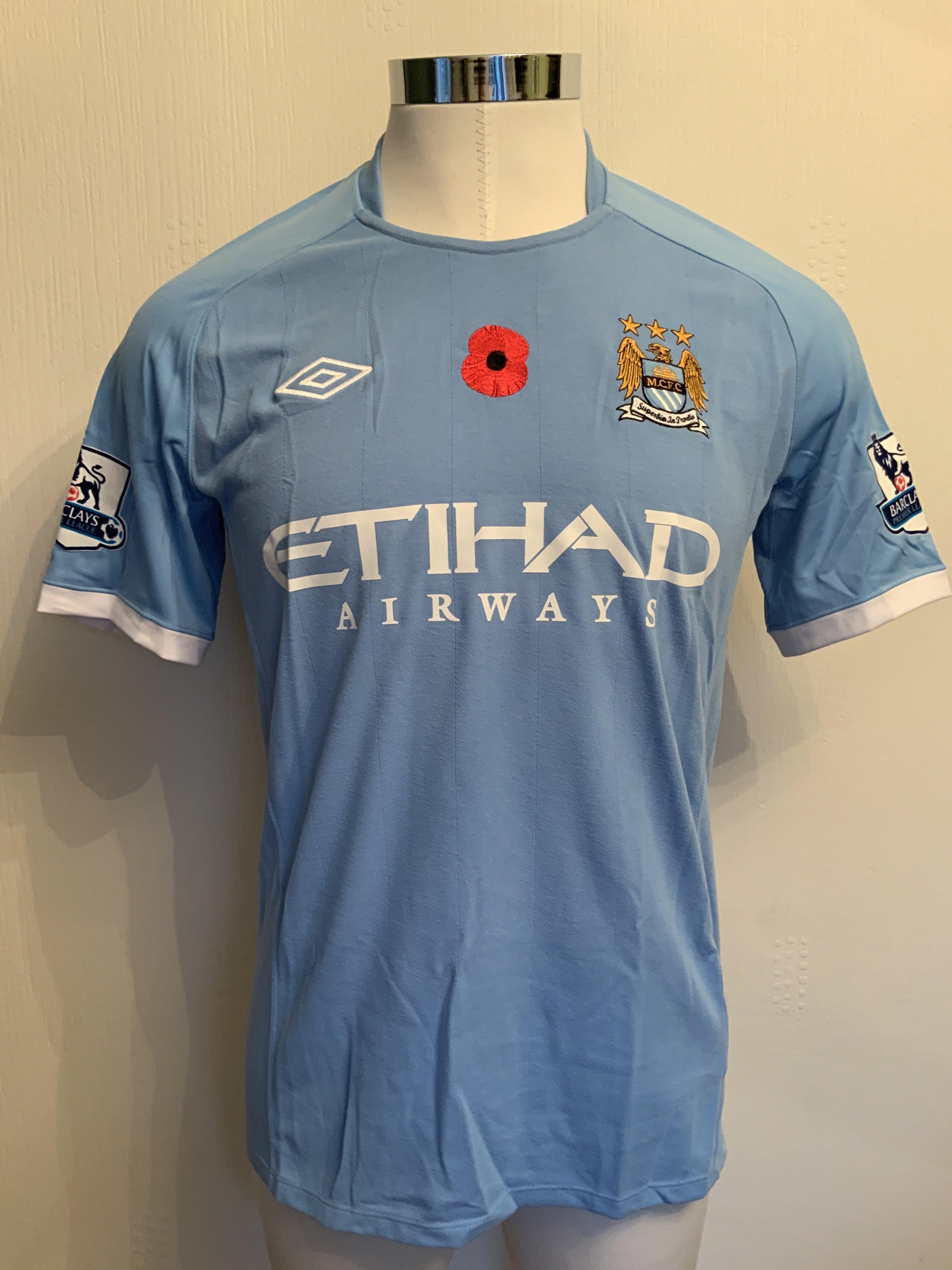 Bridge Manchester City 2010/2011 Match Worn Poppy Football Shirt: Short sleeve blue Umbro shirt