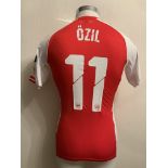 Ozil 2014/2015 Match Worn Arsenal Home Football Shirt: Red short sleeve shirt worn in a Champions