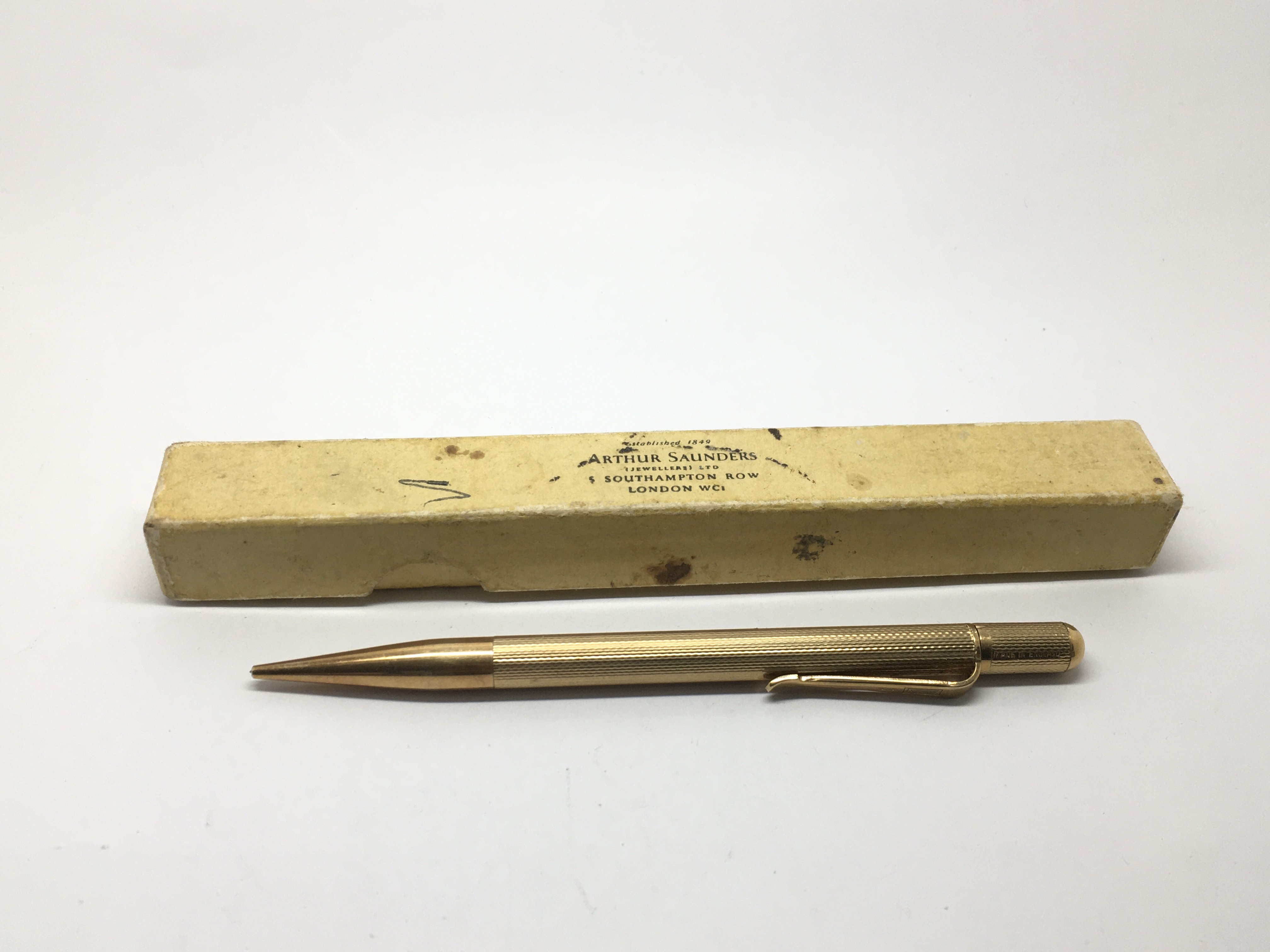 A boxed 9ct gold propelling pencil.