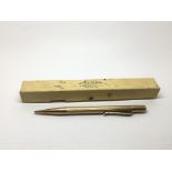 A boxed 9ct gold propelling pencil.