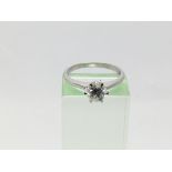 An 18ct white gold ring set with a solitaire brill